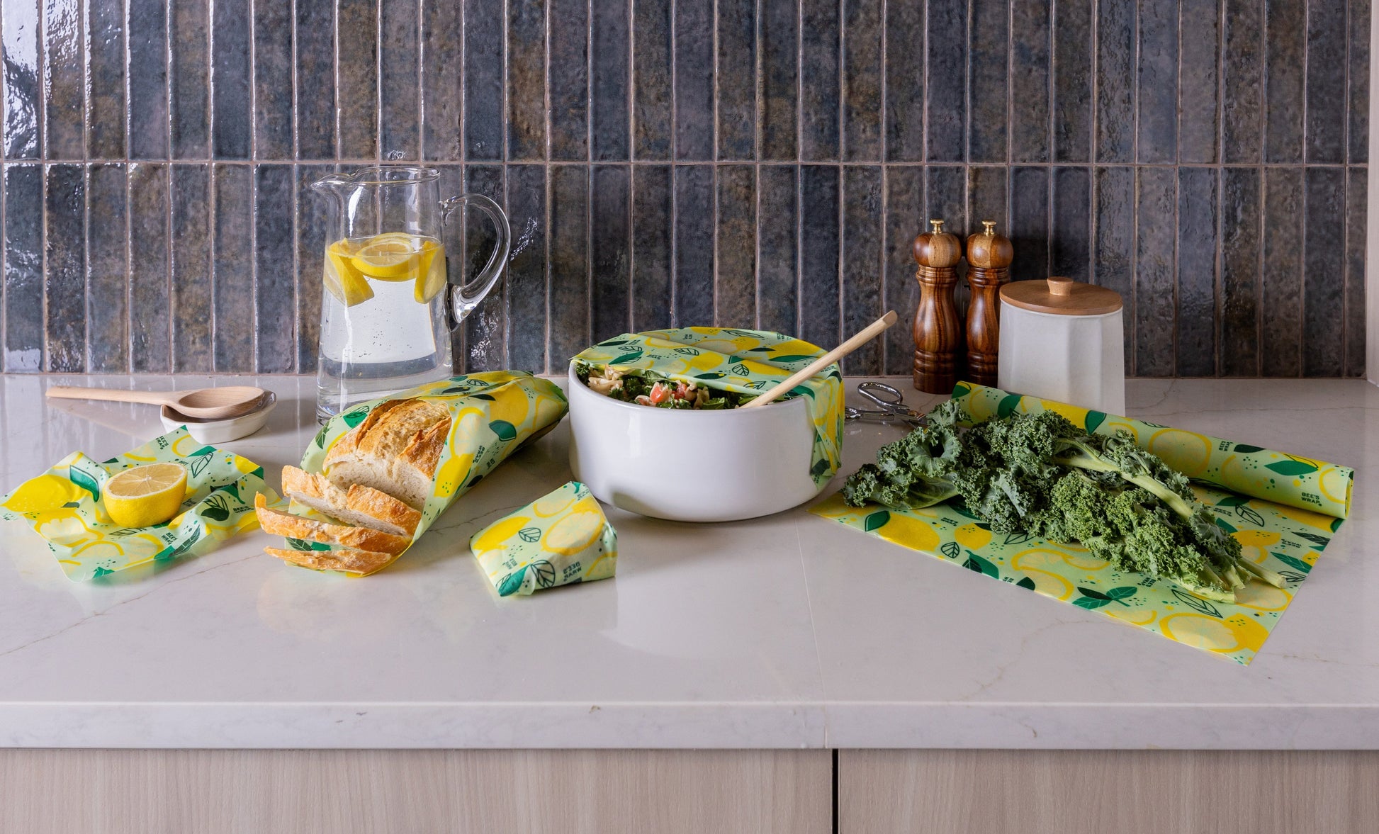 Kitchen counter with reusable wrap products in Fresh Squeeze print with food, and kitchen items.