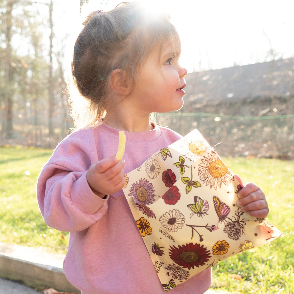 Child holding Bee's Wrap snack wrap